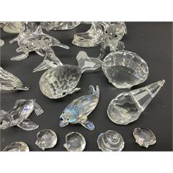 Nineteen Swarovski Crystal sea creatures, to include dolphins, seals, puffer fish, octopus, crabs, together with a quantity Swarovski Crystal shells 