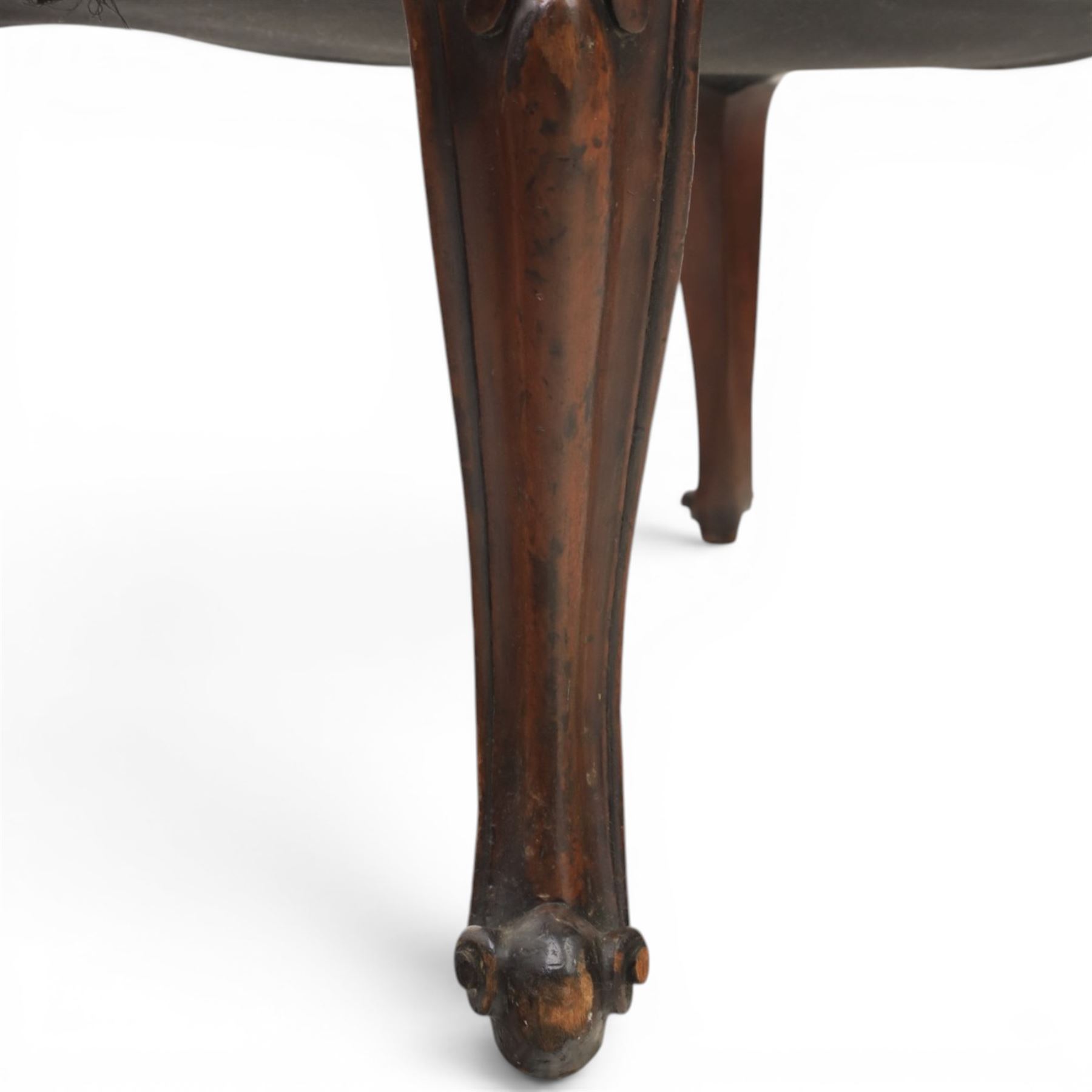 Victorian mahogany Cayley style footstool, serpentine upholstered seat raised on cabriole supports terminating in scroll feet