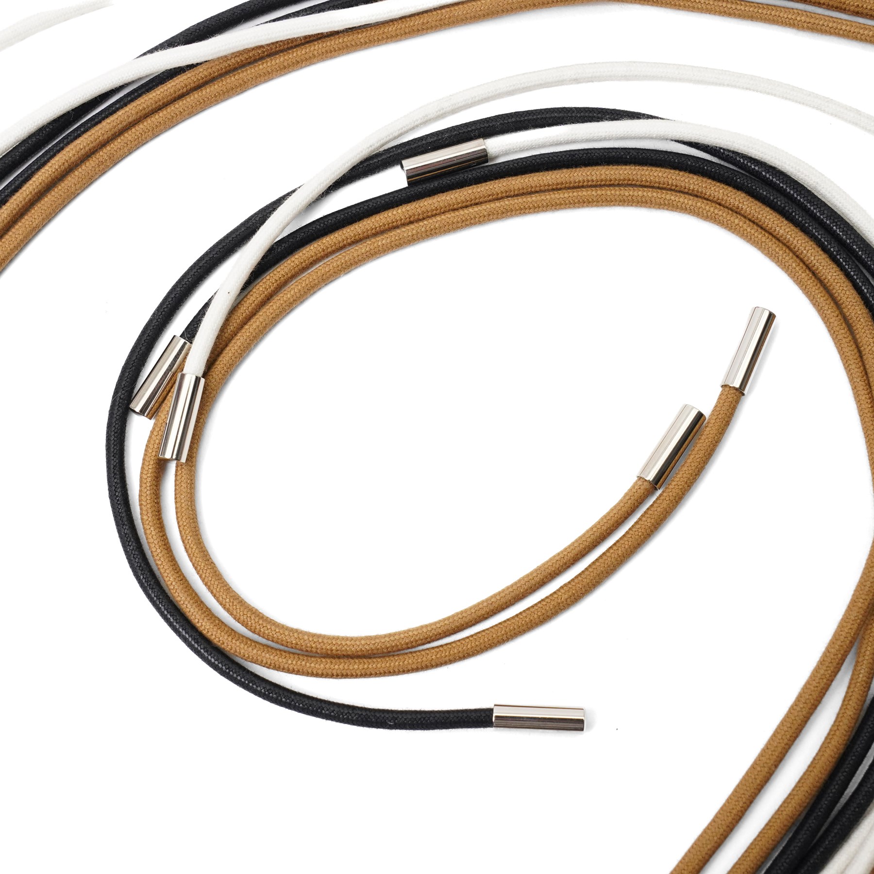 Hermès - long multi-cord belt in black, white and camel, suspending a large palladium-tone circular openwork H pendant, signed HERMES, in original box