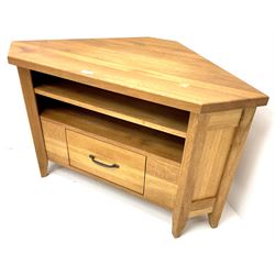 Light oak corner television stand, single shelf above drawer, stile supports 