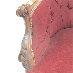 Victorian mahogany framed sofa, arched back with floral carved cresting rail, scrolling arms, acanthus carved cabriole feet, upholstered in a deep buttoned maroon fabric, W135cm