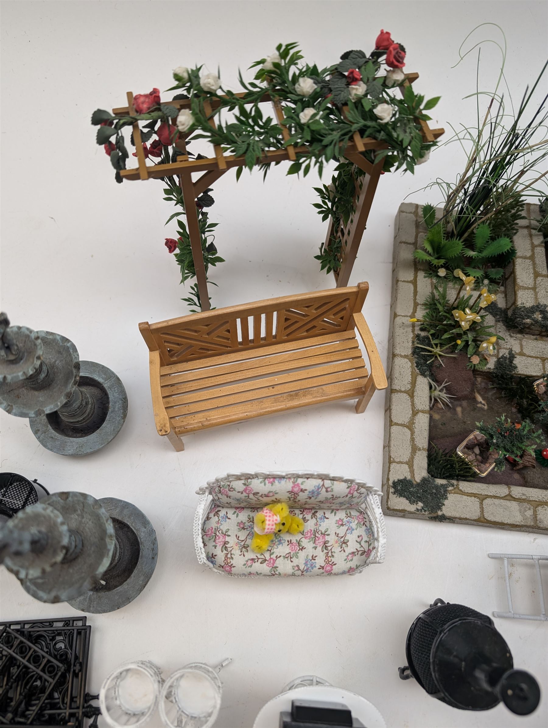 1:12 scale dolls house conservatory and garden accessories, including white wooden glazed conservatory on a stone effect base, black and white metal garden seating, barbecue, plant shelves, parasol, barbeque accessories, large planters, rabbit hutch, animals, chimenea, etc