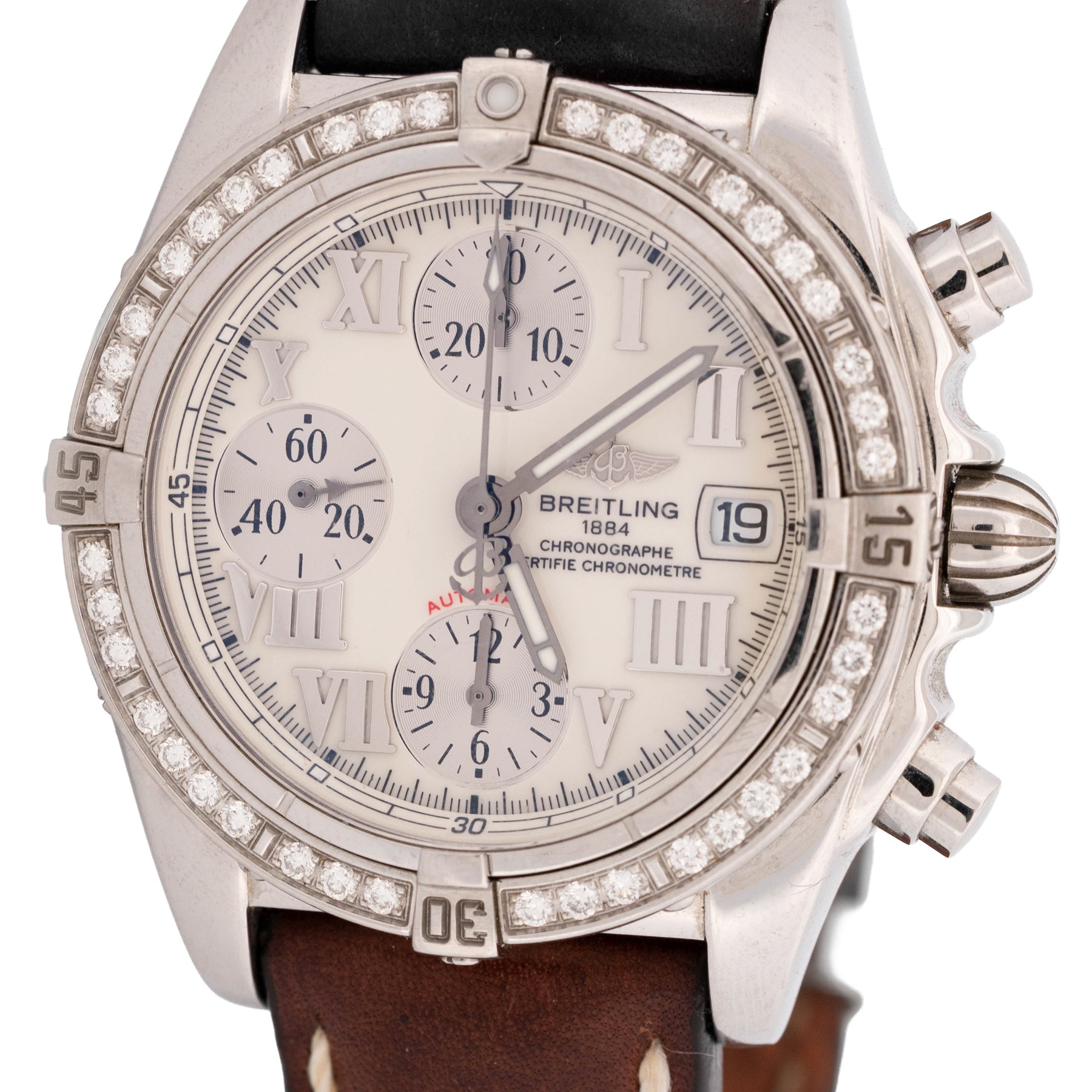 Breitling Chrono Cockpit gentleman's stainless steel diamond set automatic wristwatch, Ref. A13357, serial No. 2084732, cream dial with Roman numeral hour markers and date aperture, diamond set unidirectional rotating bezel, on Breitling brown leather strap, with fold-over clasp
