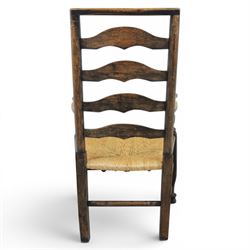 Set of seven (6+1) Georgian design country elm Lancashire dining chairs, ladder backs with rush seats, turned front leg stretcher on pad feet, height of seat 44cm, complete with fitted tie on cushions