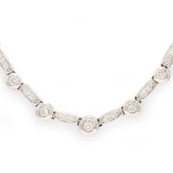 18ct white gold diamond necklace, bezel set with a single round brilliant cut diamond, spaced by two further diamonds, to a rectangular link necklace, London 2000, total diamond weight approx 0.75 carat