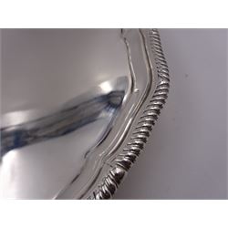 Early 20th century silver waiter, of hexagonal form, with oblique gadrooned rim, upon four ball and claw feet, hallmarked Goldsmiths & Silversmiths Co Ltd, London 1919, D21cm