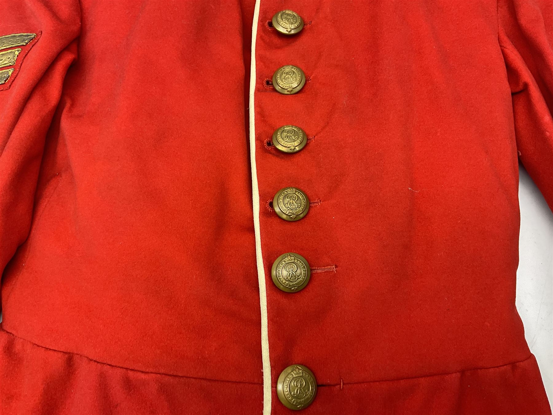 Royal Military College Sandhurst parade uniform with peaked cap and two-piece mess dress, all bearing historic manuscript labels for J.E.A. Baldwin, possibly Air Marshal Sir John Eustace Arthur Baldwin (1892-1975) who served in the British Army 1910-18 & 1944-58 and in the RAF 1918-44.