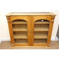  Victorian pine bookcase display cabinet, two arched doors enclosing three shelves, W128cm, H107cm, D41cm  