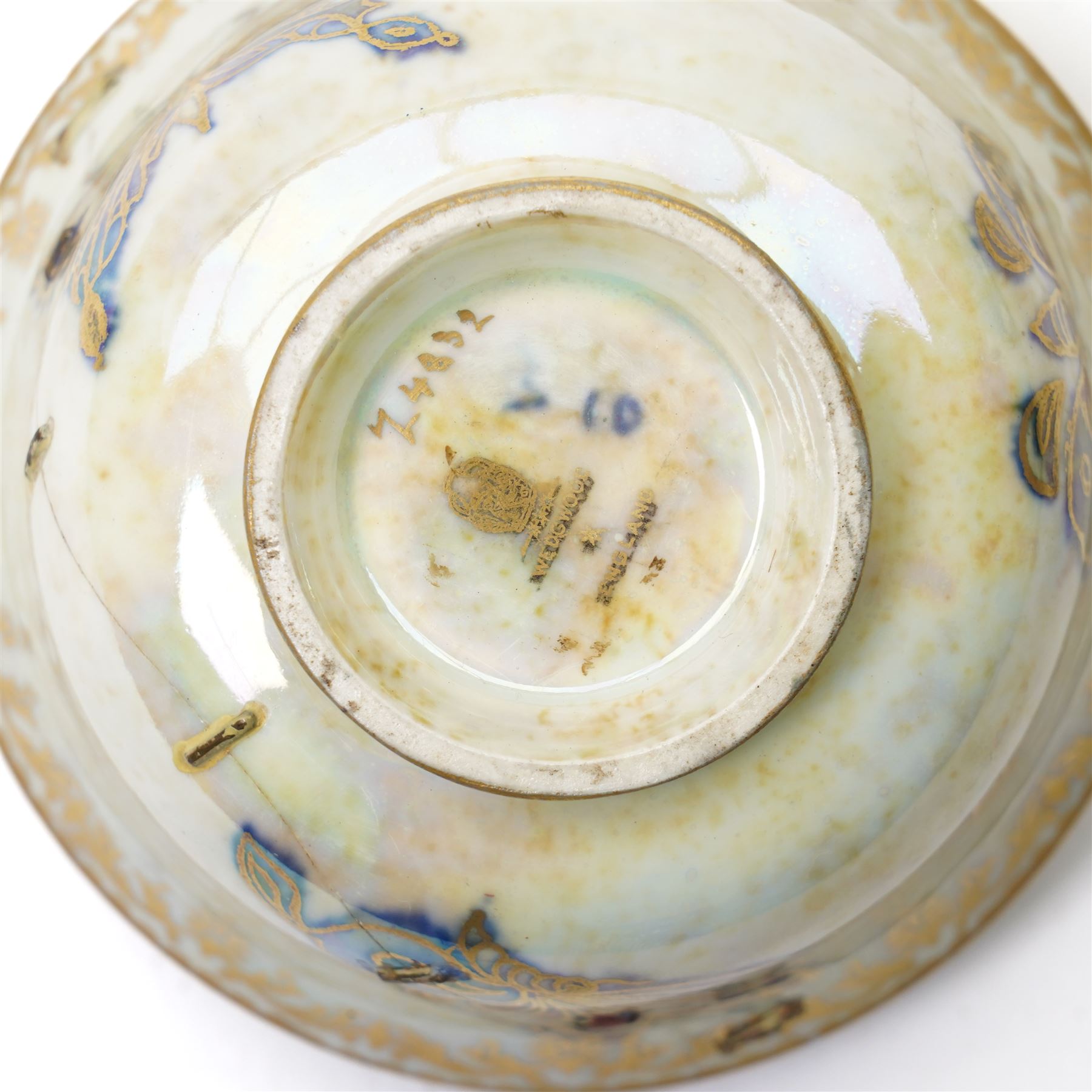 Wedgwood Fairyland lustre bowls, designed by Daisy Makeig-Jones, featuring the Hummingbird and Butterfly patterns, each with gilt stamp and painted pattern numbers Z4832 and Z5294, D10cm and D8.5cm (2)
Notes: please see condition report.
