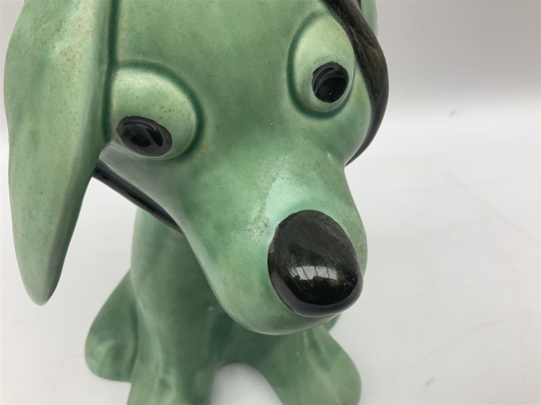 Sylvac 'toothache' dog in the green colourway, no 2451, with impressed beneath, H28.5cm