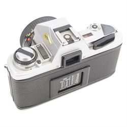 Two Minolta SLR camera bodies, comprising X-300 serial no. 8592491 and X-700 serial no. 1498583, together with five lenses including Sigma Telephoto 1:5.6 f=400mm serial no. 1018435, Vivitar Series 1 28mm 1:1.9 VMC Auto Wide Angle Lens no. 37822044, two Minolta MD 50mm 1:1.7 49mm lens nos. 7177581 & 8384472, Tamron 70-210mm 1:3.8-4 lens no. 8316867 and camera accessories, all within a soft carry case