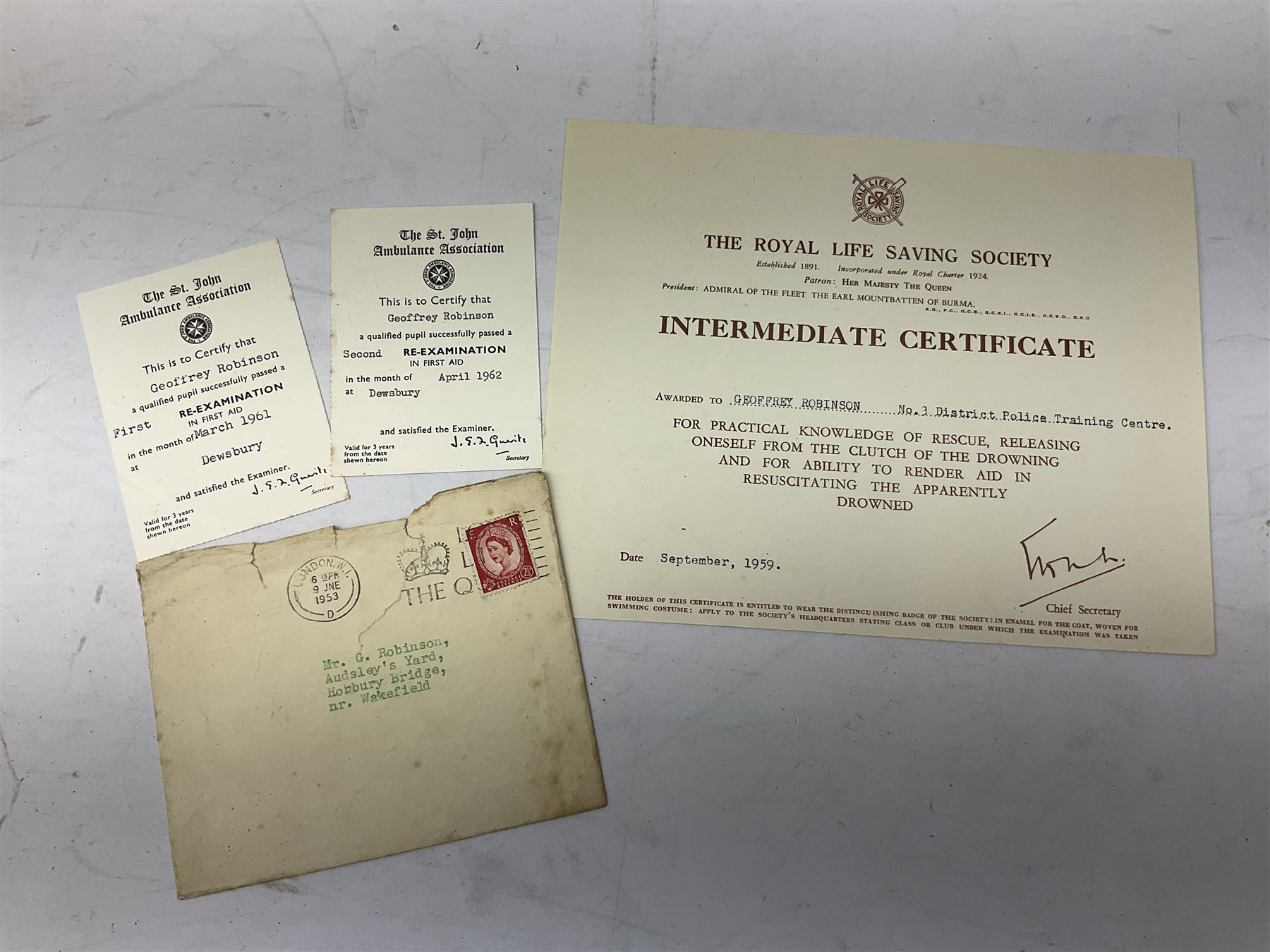 Archive of memorabilia and ephemera relating to Pc. (later Sgt.) Geoffrey Robinson of Dewsbury (later West Yorkshire) police force including cased Long Service and Good Conduct Medal; helmet plates and cap badges, collar numbers and uniform buttons, whistles, certificates, photographs, plaque etc 1960s - 1990s