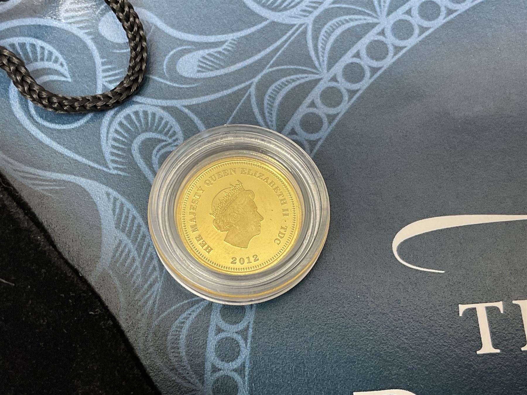 Commemorative Tristan Da Cunha coins including 2013 'The 60th Anniversary of the Coronation of Queen Elizabeth II Pure Silver Crown Set' cased with certificate,  2014 'World War I Silver Commemorative' one crown cased with certificate, 9ct gold 2012 half crown approximately 1 gram etc