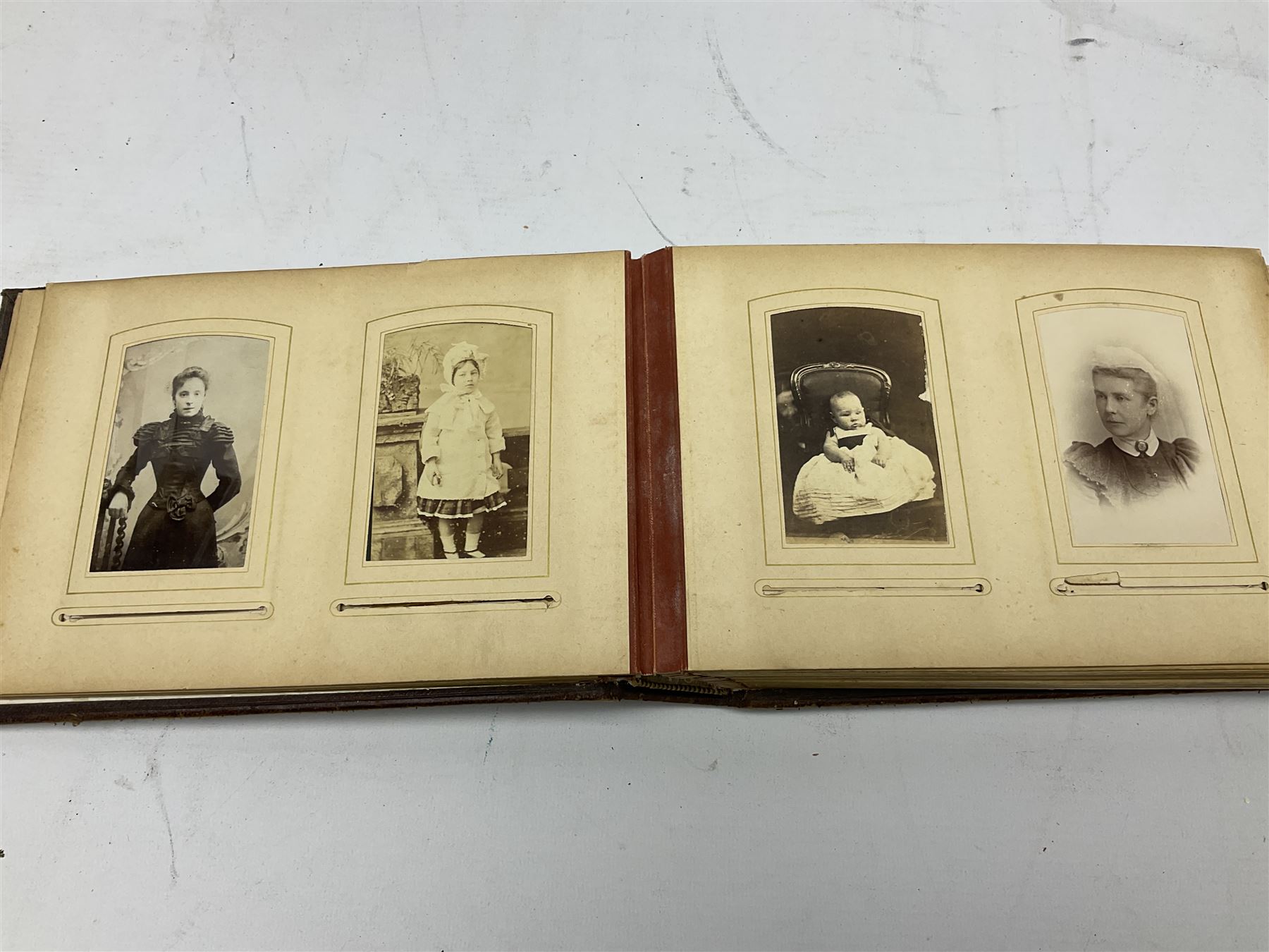 Victorian leather bound musical photo album, together with another victorian photo album, with photographs 