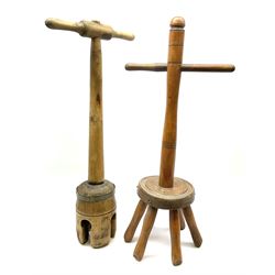 A Victorian dolly peg, together with a further example, both approximately H78cm.