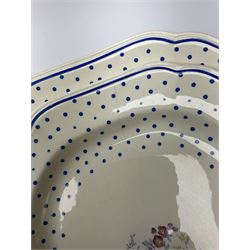 Copeland Spode Polka Dot pattern dinner and tea wares, comprising four dinner plates, seven salad plates, four dessert plates, six twin handled soup bowls and two saucers, six chocolate cups with covers and six saucers, two sauce boats, two tureens and covers, and four graduated serving platters. 