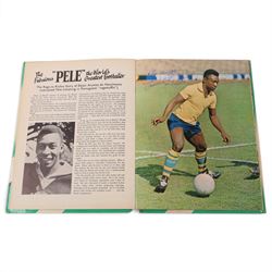 'World Cup 1966 England' hardback book, signed to inner front page by thirteen legendary footballers, to include Bobby Moore, Pele, George Cohen, Bobby Charlton, Alan Ball, Nobby Stiles, Roger Hunt, Peter Thompson, Kenneth Wolstenholme, Jairzinho, Garrincha, Martin Peters and Geoff Hurst, with certificate of authenticity from Chaucer Auctions