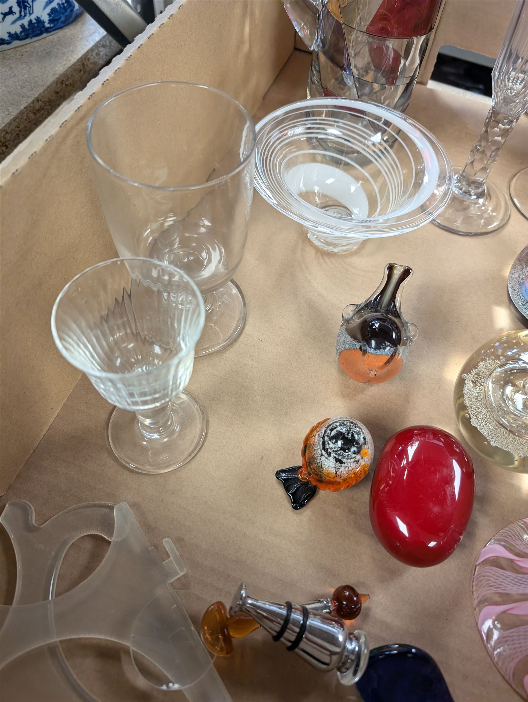 Collection of glassware, including two Caithness paperweights, Langham robin paperweight, Murano bell, etc