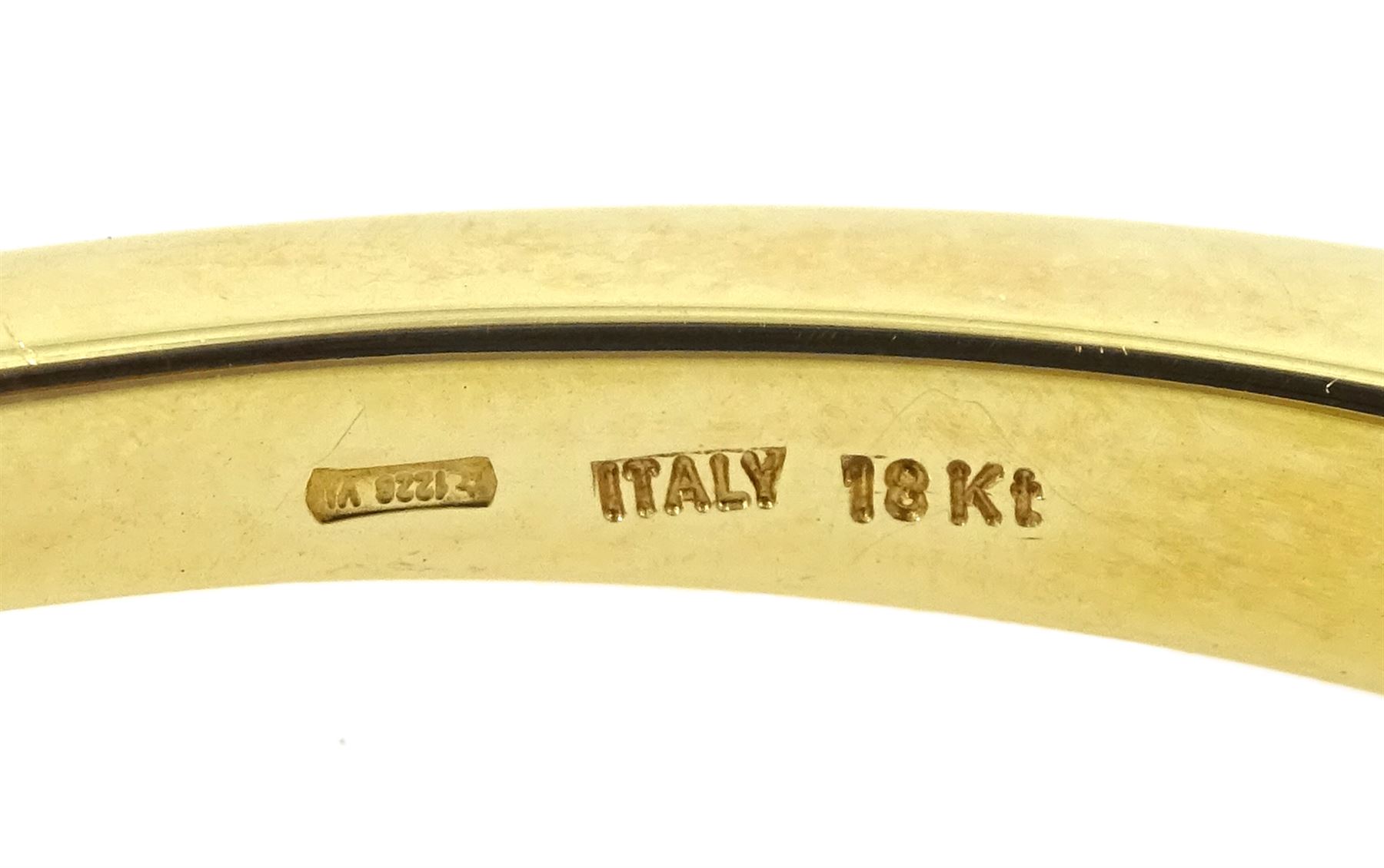 Roberto Coin 'Parisienne' 18ct gold three row round brilliant cut diamond bangle, with a signature round cut ruby to the underside and ruby set clasp, Birmingham 2006, boxed