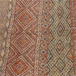 Moroccan Berber kilim rug, flatwoven with bands of geometric lozenge and chevron motifs in red, orange, ivory and green, decorated with applied sequins, fringed ends