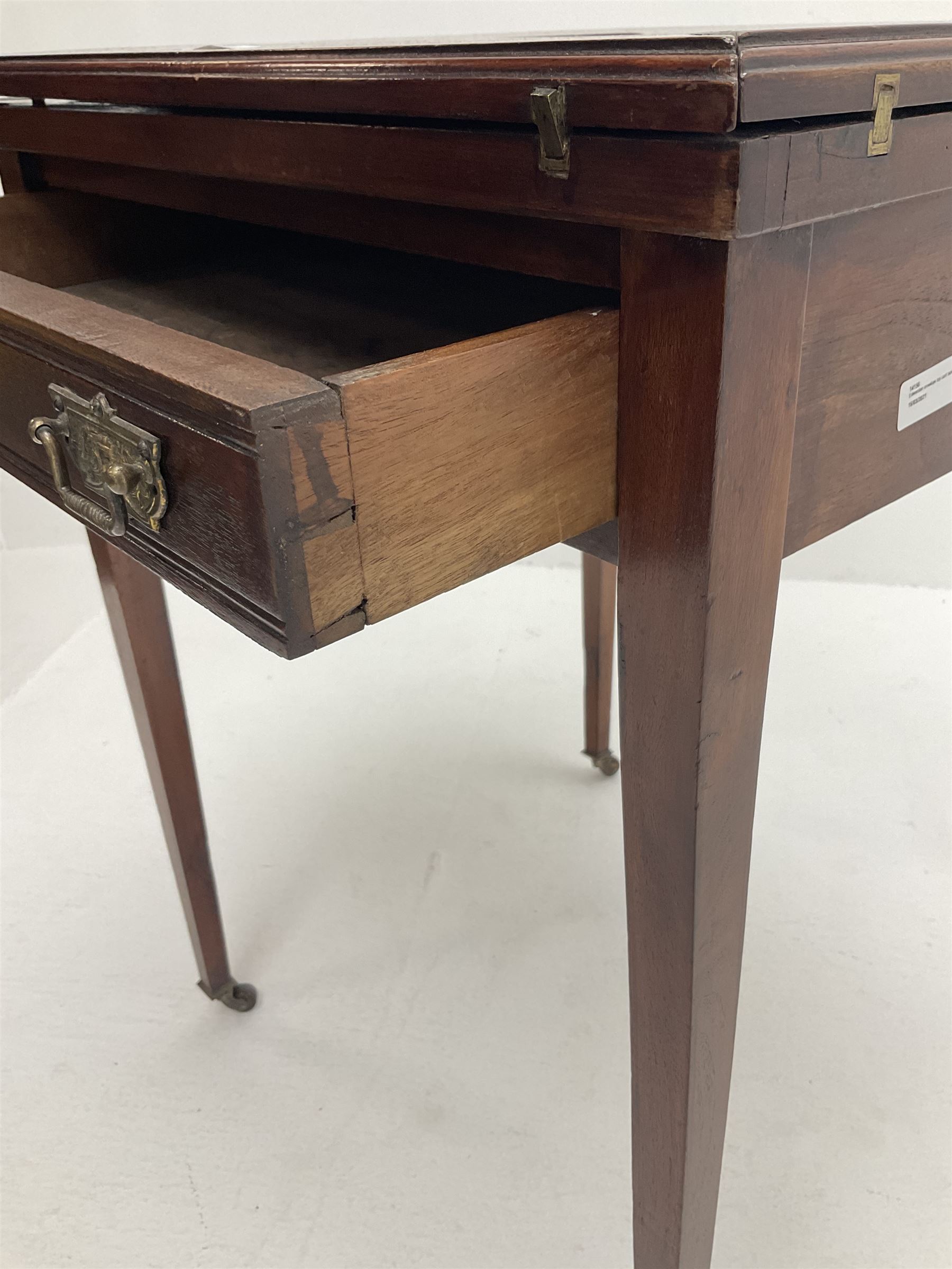 Edwardian envelope card table, inlaid baize top, four counter wells, stile supports and castors 