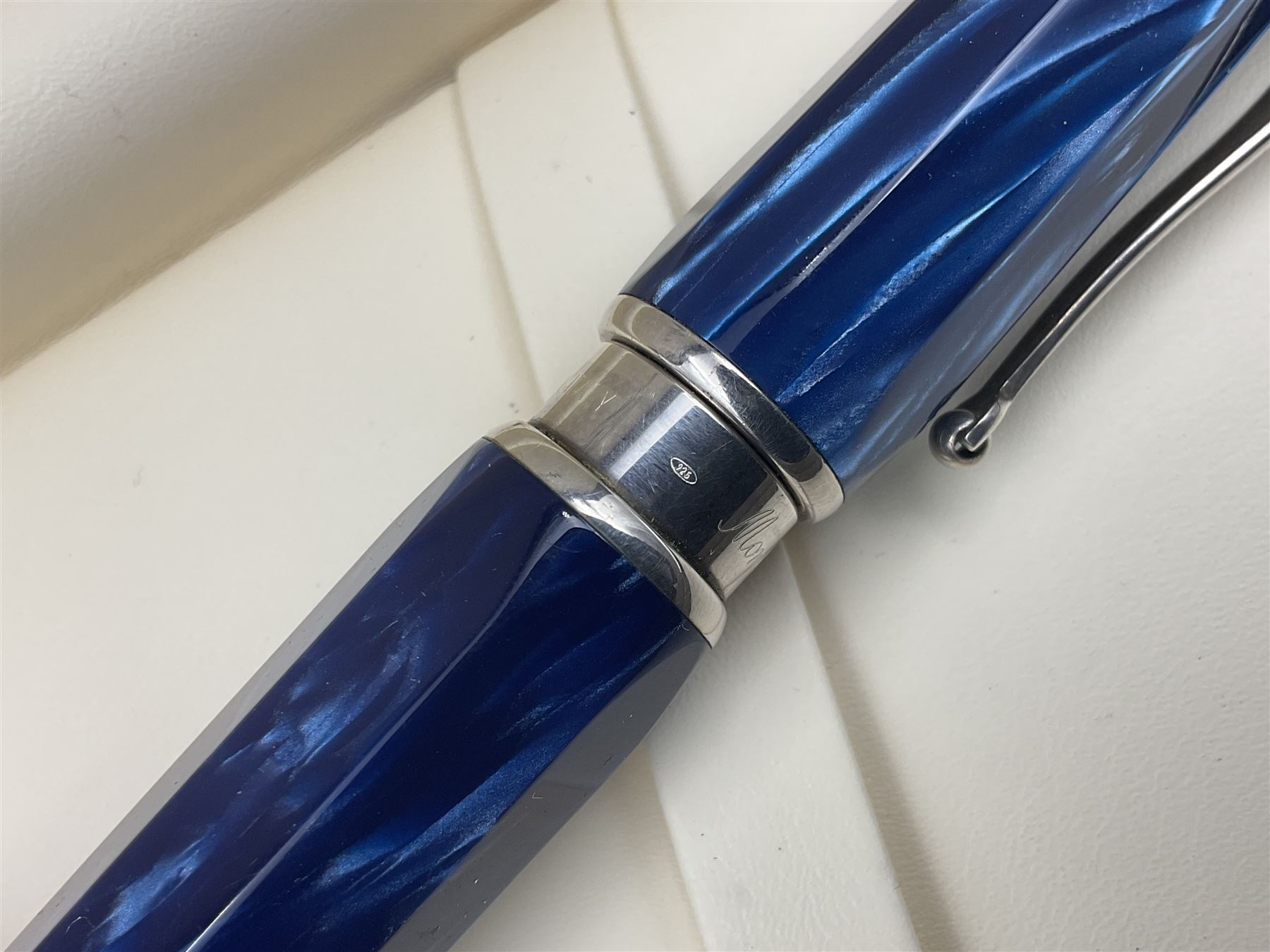 Montegrappa Emblema fountain pen, the blue pearl marbled barrel of octagonal form with silver mounts stamped 925 and silver mounted cap with 1912 emblem and clip with roller, in box, L13.5cm