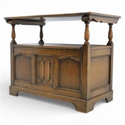 20th century oak monks bench with hinged box seat, with blind fretwork to the seat, panelled front and sides with linen fold panel in the centre