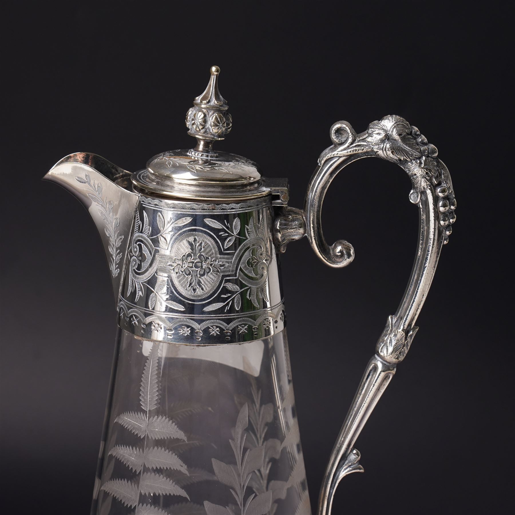 Victorian opaque glass ewer with clear cut decoration and clear glass handle H28cm and an etched glass claret jug with silver plated cover and handle H31cm