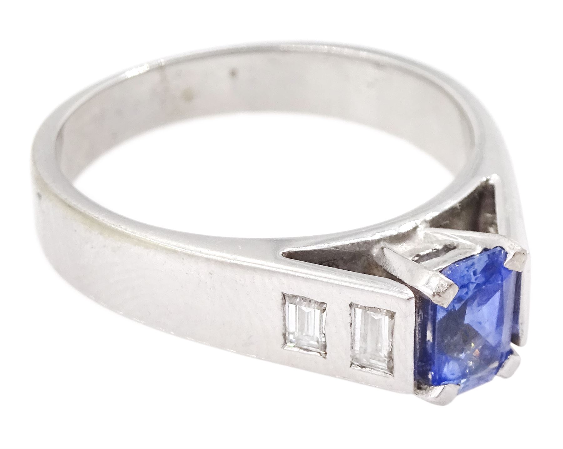White gold sapphire and diamond ring, single stone radiant cut sapphire of approx 0.65 carat, with two baguette cut diamonds set either side, hallmarked 9ct