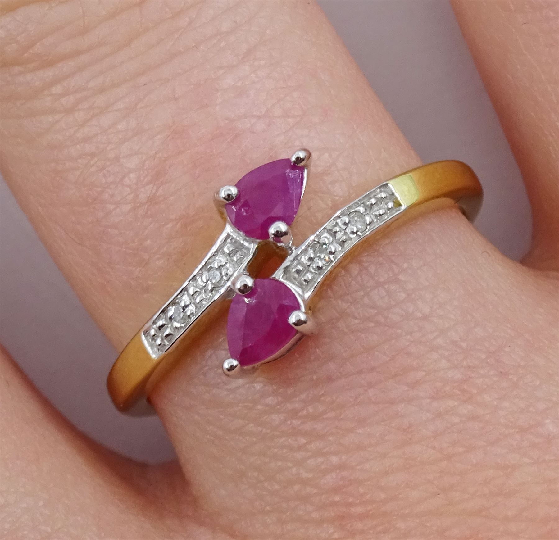 Silver-gilt pear shaped ruby ring, with diamond set shoulders, stamped 925