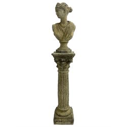 Classical design cast stone female bust depicting Artemis, raised on fluted Corinthian column with acanthus leaf capital, stepped square base, looking right 