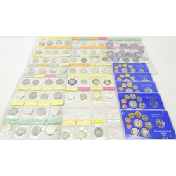  Collection of German coins including Bundesrepublik Deutschland coin sets 1975 to 1979, in plastic display cases, various East and West German commemorative silver coins etc, in coin album pages  