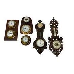 A selection of barometers and wall clocks