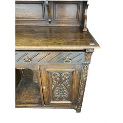 Late 19th century carved oak dresser, fitted with two drawers and two cupboards, raised upper piece with mottled coloured glass door