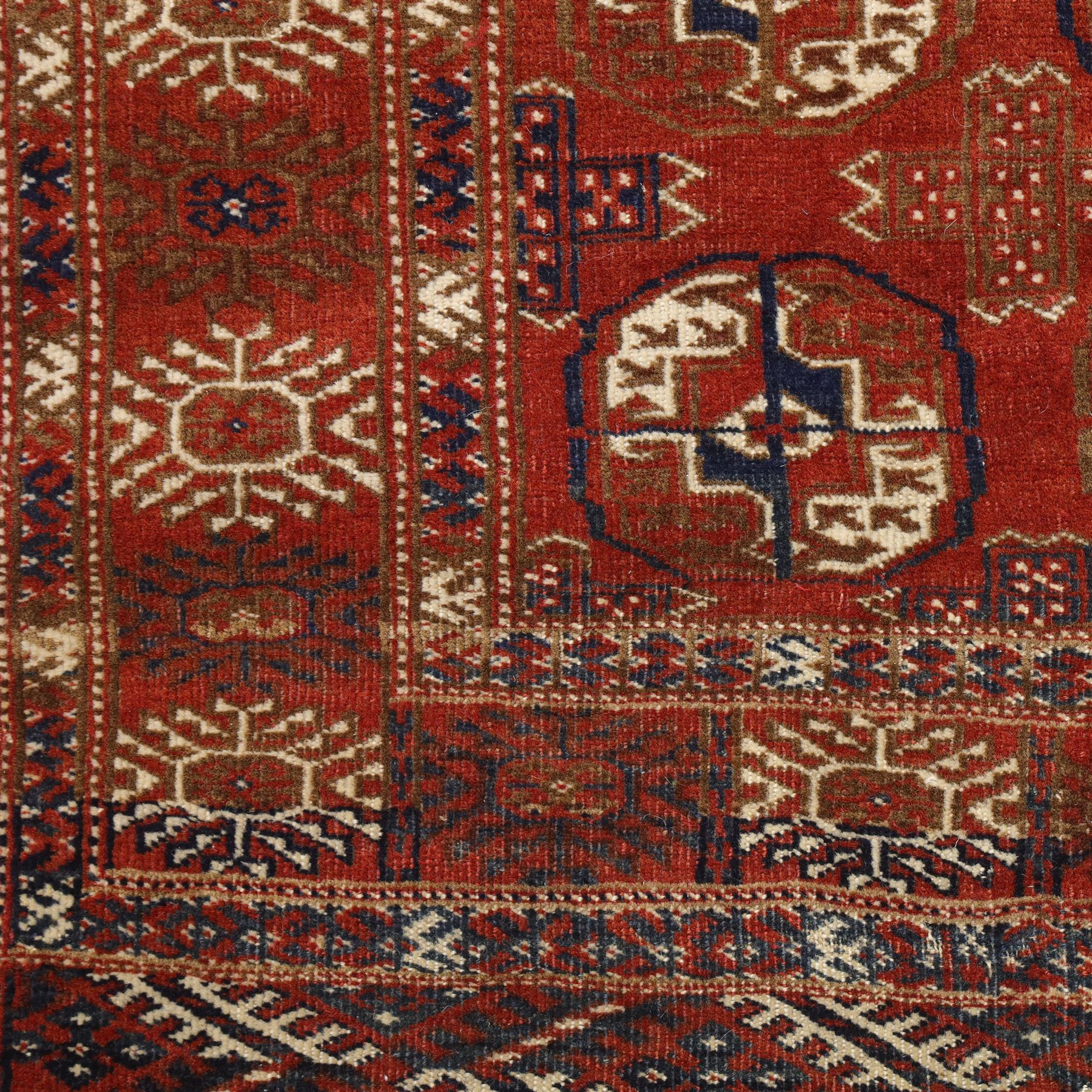 Tekke Turkman rug, madder red field decorated with repeating rows of octagonal guls, framed by multiple geometric borders, 86x133cm and an Anatolian flatweave kilim, 95x140cm, (2)