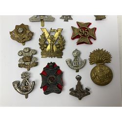 Over thirty regimental cap badges for fusiliers, Yorkshire interest, Light Infantry etc including Royal Scots and Welsh fusiliers, Durham L.I., KO Yorkshire L.I., Oxford & Bucks L.I., Green Howards, East Yorkshire, West Riding, York North Riding etc 