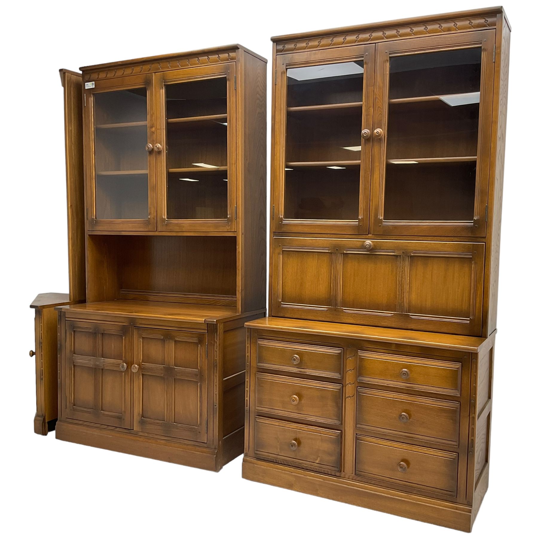 Ercol - mid-20th century dark elm 'Old Colonial' three sectional wall display unit, comprising two units and corner unit, fitted with open shelves, glazed cupboards and drawers