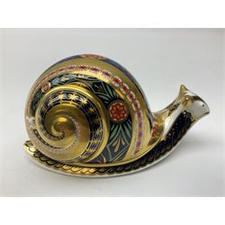 Three Royal Crown Derby paperweights, Garden Snail, with gold stopper, Farmyard Cockerel, with gold stopper and Carolina Duck, with gold stopper, all with printed mark beneath 