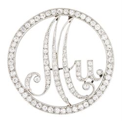 Art Deco platinum and diamond initial brooch, the circular frame and initials 'Mu' milgrai...