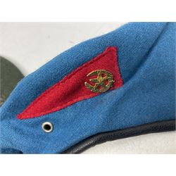 Four paratrooper berets - Russian, Italian, British and Foreign Legion; all with badges (4)