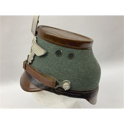 WW2 German rural police shako with helmet plate and liner; bears label 'Hans Romer Echt Fiber-Tschako Neu-Ulm (Donau)'