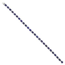 18ct white gold sapphire and diamond bracelet, twenty-six oval cut sapphires, each spaced ...