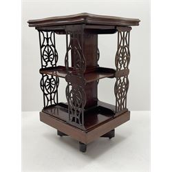 Edwardian inlaid mahogany and satinwood revolving bookcase, shaped moulded top over two tiers with fretwork side splats
