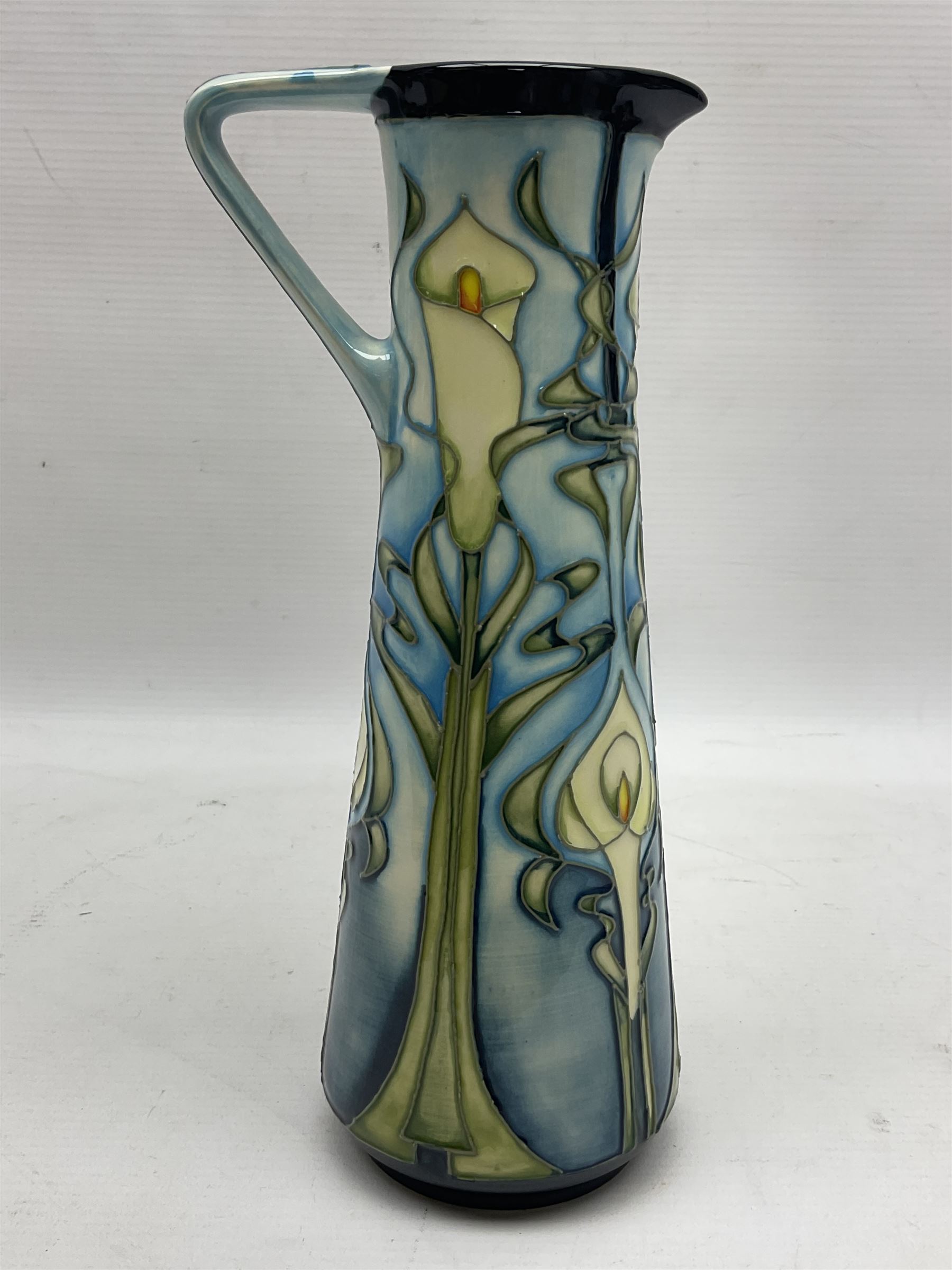 Moorcroft jug, of tapering form, decorated in the Calla Lily pattern by Emma Bossons, circa 2001, H24cm