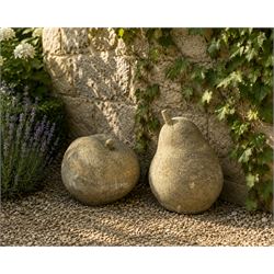 Pair of weathered cast stone garden models of fruit, in the form of an apple and pear