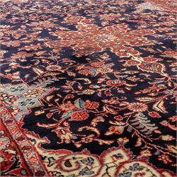 Two hand-knotted rugs, comprising Persian floral rug, dark blue ground decorated with scrolling foliage and flowerheads within a red floral border (H 208cm, W 134cm); Bokhara type rug, red ground with repeating gul motifs and geometric guard borders (H 174cm, W 94cm)