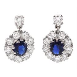  Pair of 18ct white gold oval sapphire and round brilliant cut diamond cluster, pendant stud earrings, total sapphire weight approx 1.20 carat, total diamond weight approx 1.50 carat