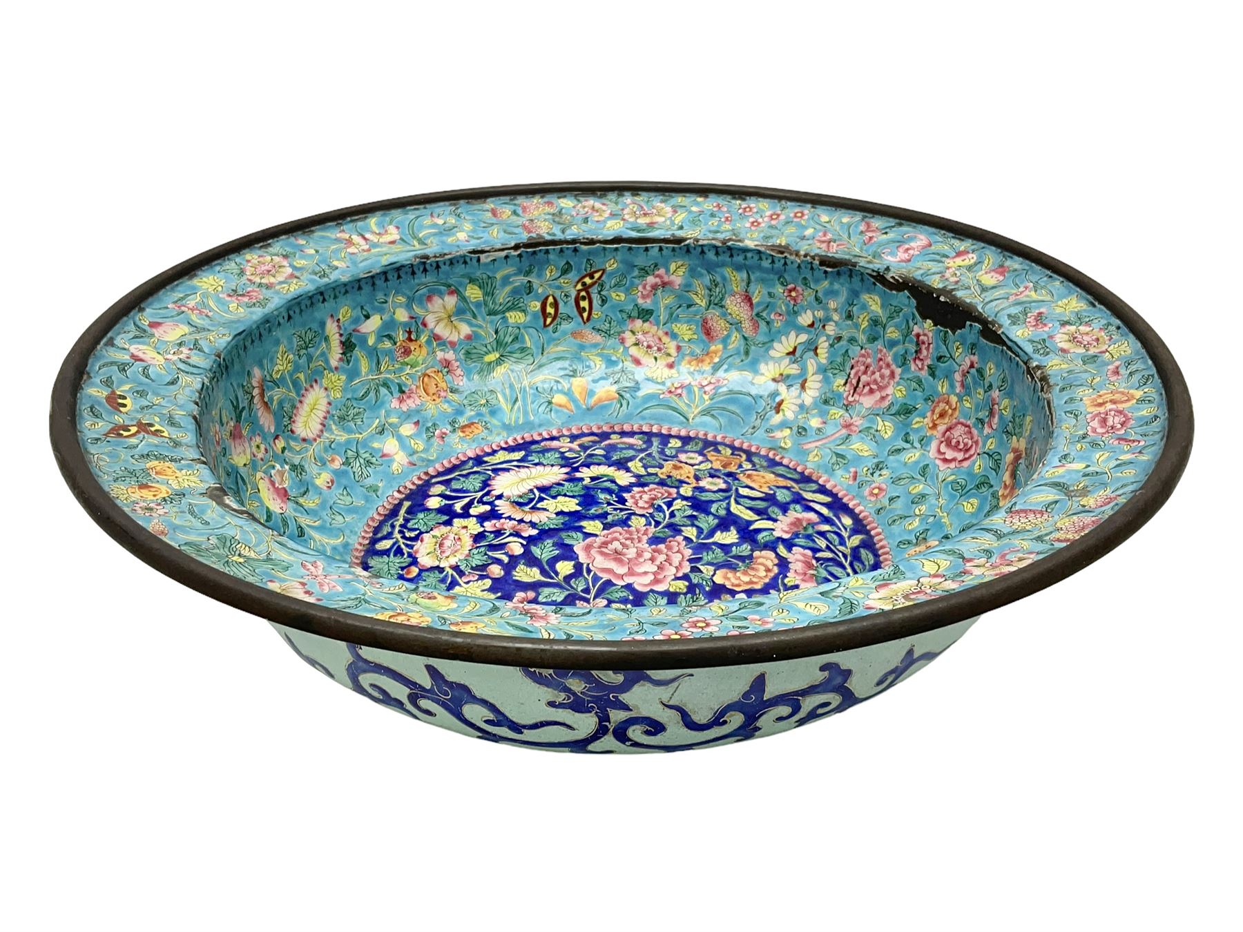 18th/19th century Chinese Canton enamel basin, the circular basin with flat everted rim, decorated with scrolling foliate and fruit decoration on a blue ground, D43cm