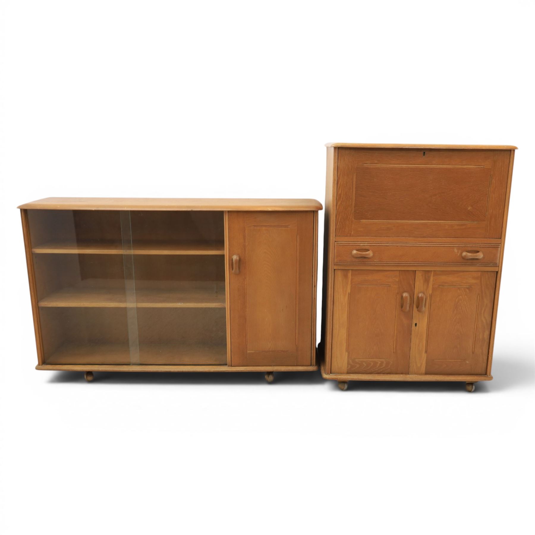 Mid-20th century elm and beech drinks cabinet with fall-front, with matching low bookcase

(Cabinet H 113cm, D 42cm, W 80cm)
(Bookcase H 87cm, D 35cm, W 137cm)