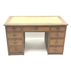  Edwardian oak twin pedestal desk, leather inset top, eight short and one long drawer, W122cm, H69cm, D67cm  
